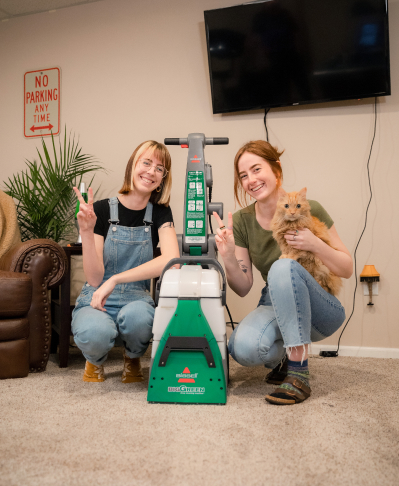 Ladies with Carpet Cleaner Rug Doctor by BISSELL